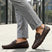 Bugatti Olexa bordo slip-on shoes in brown premium leather, featuring a decorative metal accent and rubber soles.
