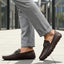 Bugatti Olexa bordo slip-on shoes in brown premium leather, featuring a decorative metal accent and rubber soles.
