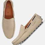 Sand-colored leather slip-on shoes by bugatti, featuring a geometric textured upper and a minimalist design.