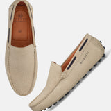 Sand-colored leather slip-on shoes by bugatti, featuring a geometric textured upper and a minimalist design.