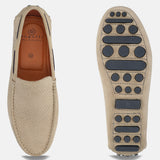 Sand-colored leather slip-on casual shoes by bugatti, featuring textured uppers and patterned outsoles.