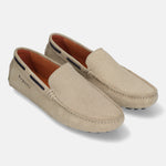 Sand leather slip-on shoes by bugatti, with a subtle woven texture and dark accent stripe.