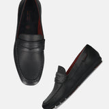 A black Men's bugatti Drivers featuring a round toe apron toe, zero heels heel. Made from premium genuine leather with a durable rubber outsole, this slip-on design offers both style and comfort.