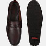 Brown bugatti leather slip-on shoe, featuring a moc toe and comfortable sole, shown alongside its textured outsole.