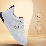 White comfort sneaker by bugatti with navy and red accents, shown at an angle on a warm-toned background.
