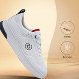 White comfort sneaker by bugatti with navy and red accents, shown at an angle on a warm-toned background.
