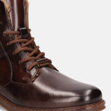 A brown Men's bugatti Ankle Boots featuring a round toe plain toe, stacked heel, and a wide fit. Made from premium genuine leather with a durable tpr outsole, this laces design offers both style and comfort.