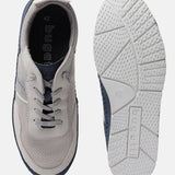 Sand-colored low top sneaker by bugatti with a textured surface, shown with white soles.