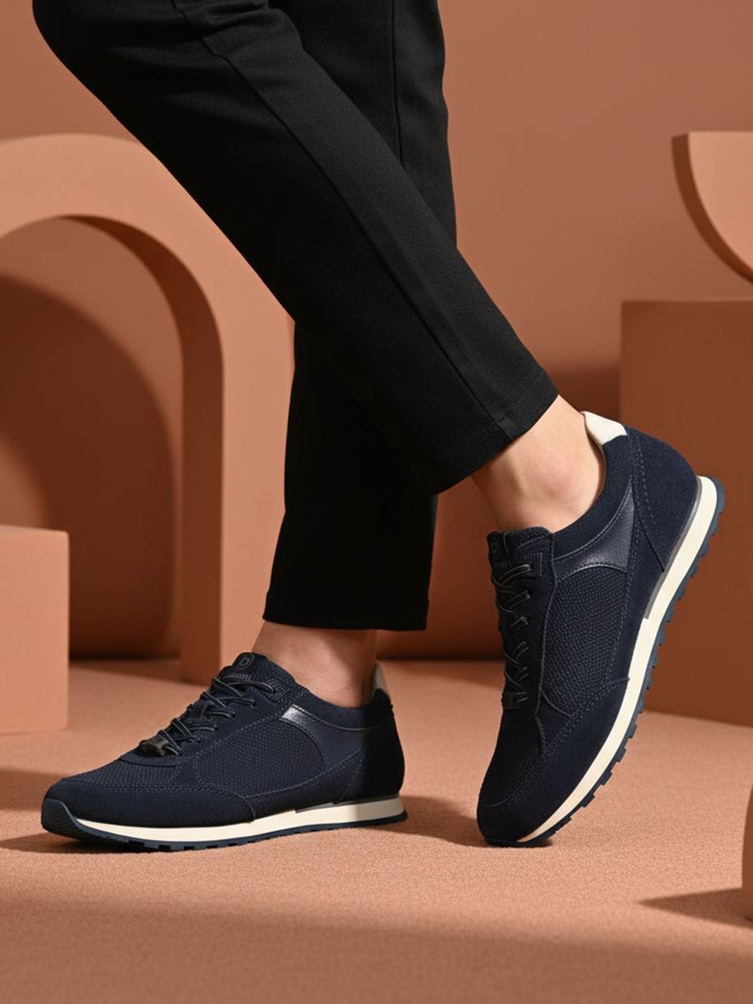 bugatti Ivar dark blue sneakers with premium leather accents, white midsoles, and dark laces.
