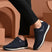 bugatti Ivar dark blue sneakers with premium leather accents, white midsoles, and dark laces.
