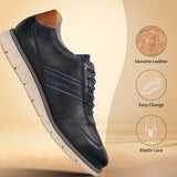 Dark blue leather sneakers by bugatti with tan accents, featuring a perforated design and a segmented sole.