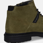 Cropped back view of a dark green suede Bugatti boot with a black sole and the brand name on the side.

