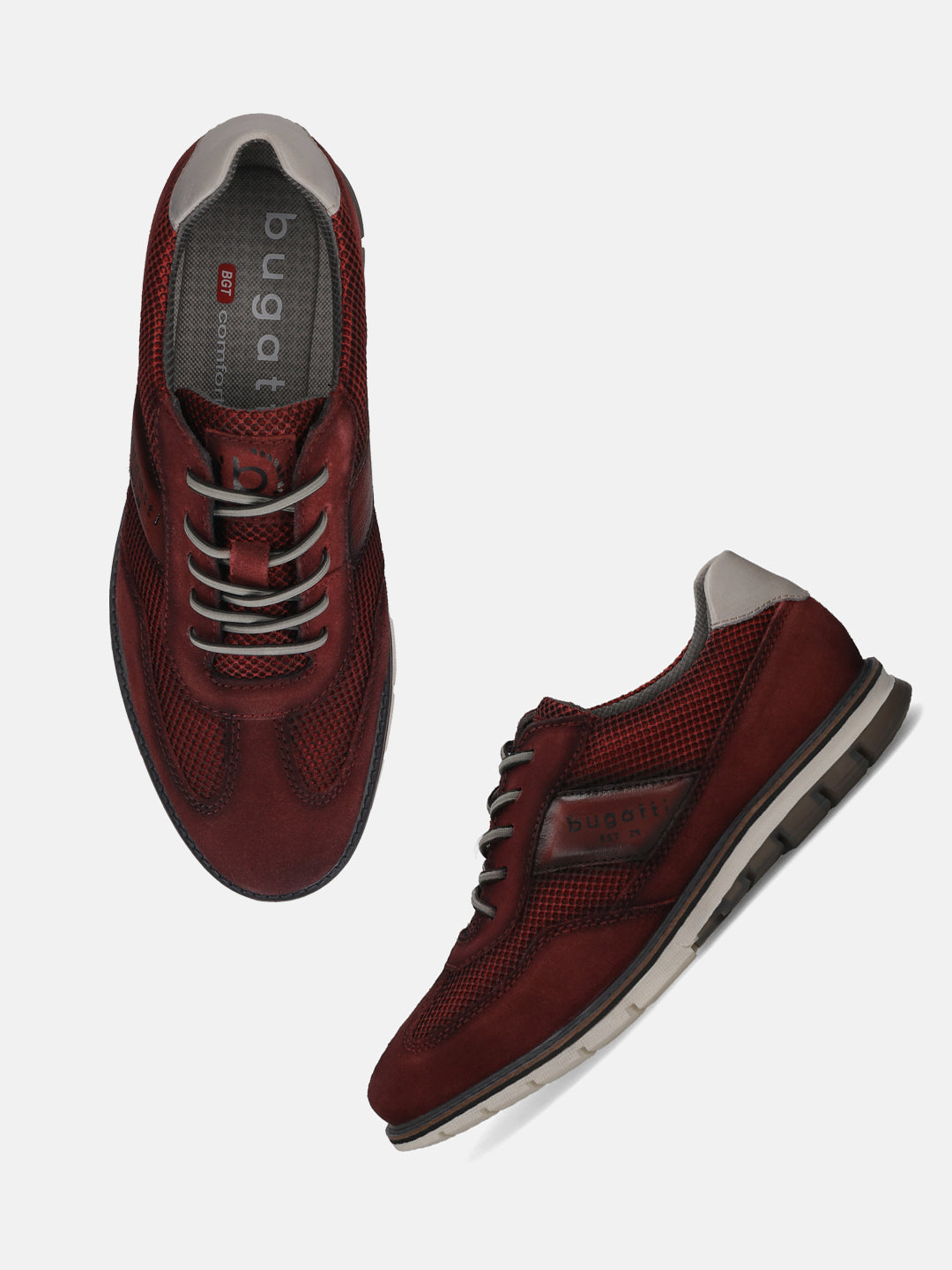 A grey Men's bugatti Casuals Shoes featuring a round toe wing tip, zero heels heel, and a wide fit. Made from premium genuine leather with a durable tr outsole, this laces design offers both style and comfort.