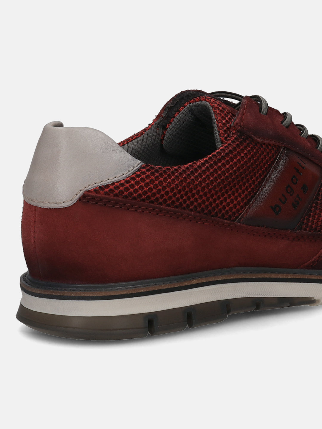 A grey Men's bugatti Casuals Shoes featuring a round toe wing tip, zero heels heel, and a wide fit. Made from premium genuine leather with a durable tr outsole, this laces design offers both style and comfort.