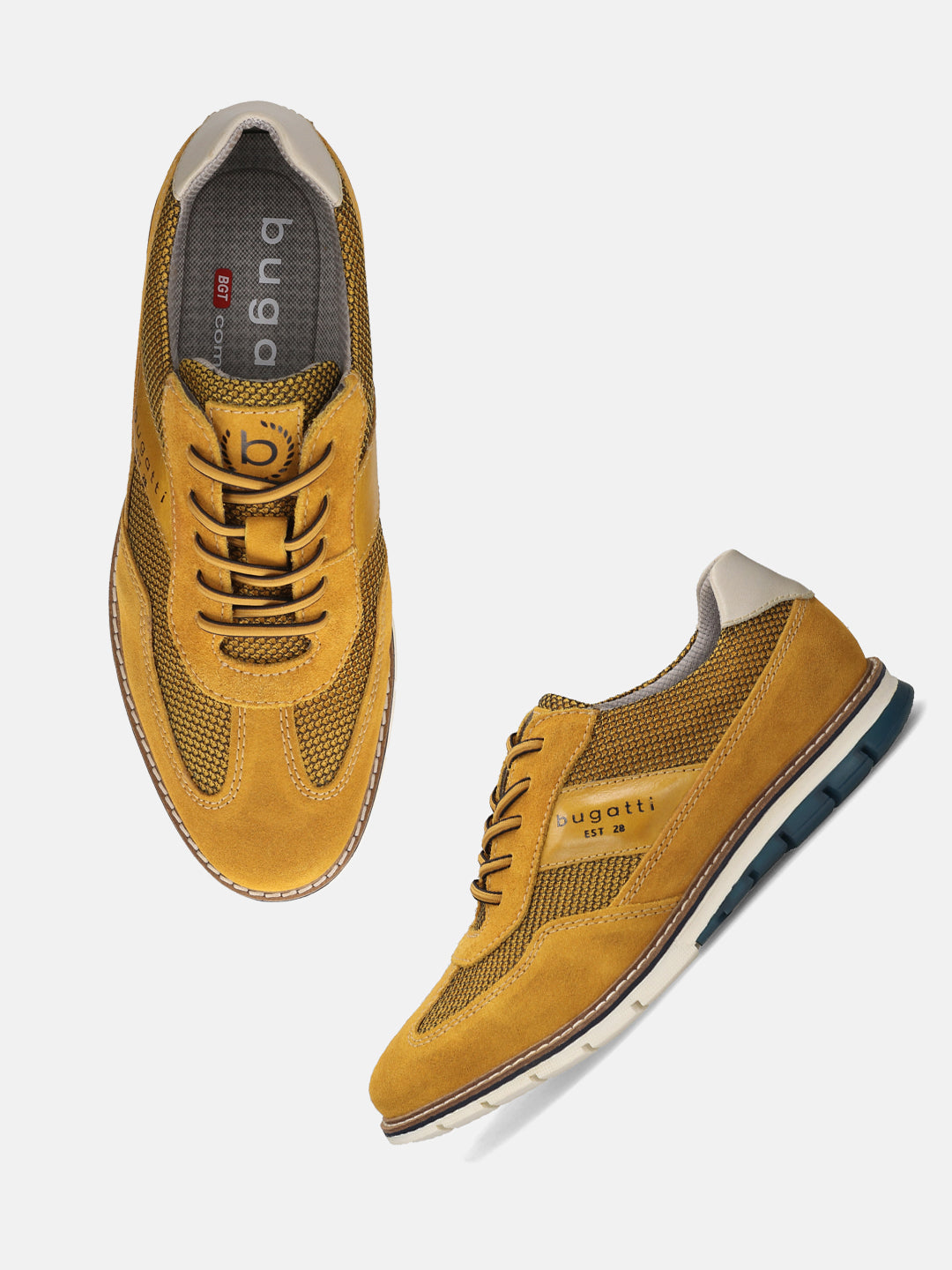 A yellow Men's bugatti Casuals Shoes featuring a round toe wing tip, zero heels heel, and a wide fit. Made from premium genuine leather with a durable tr outsole, this laces design offers both style and comfort.