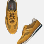 A yellow Men's bugatti Casuals Shoes featuring a round toe wing tip, zero heels heel, and a wide fit. Made from premium genuine leather with a durable tr outsole, this laces design offers both style and comfort.