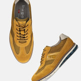 A yellow Men's bugatti Casuals Shoes featuring a round toe wing tip, zero heels heel, and a wide fit. Made from premium genuine leather with a durable tr outsole, this laces design offers both style and comfort.