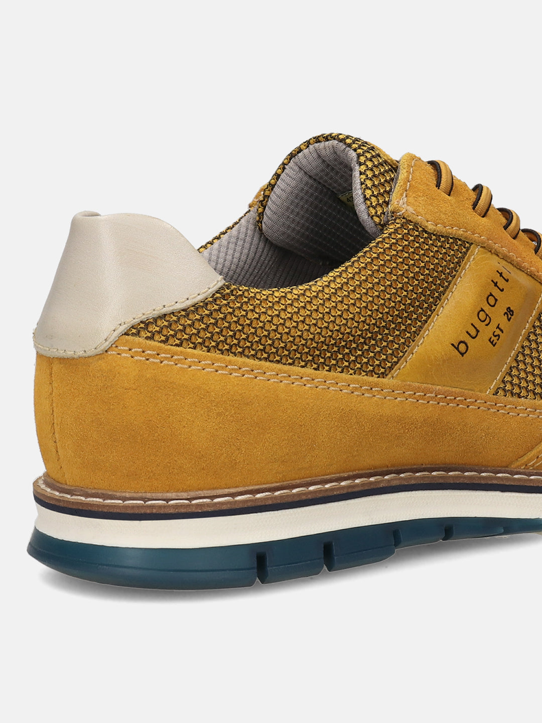 A yellow Men's bugatti Casuals Shoes featuring a round toe wing tip, zero heels heel, and a wide fit. Made from premium genuine leather with a durable tr outsole, this laces design offers both style and comfort.
