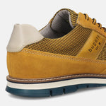 A yellow Men's bugatti Casuals Shoes featuring a round toe wing tip, zero heels heel, and a wide fit. Made from premium genuine leather with a durable tr outsole, this laces design offers both style and comfort.