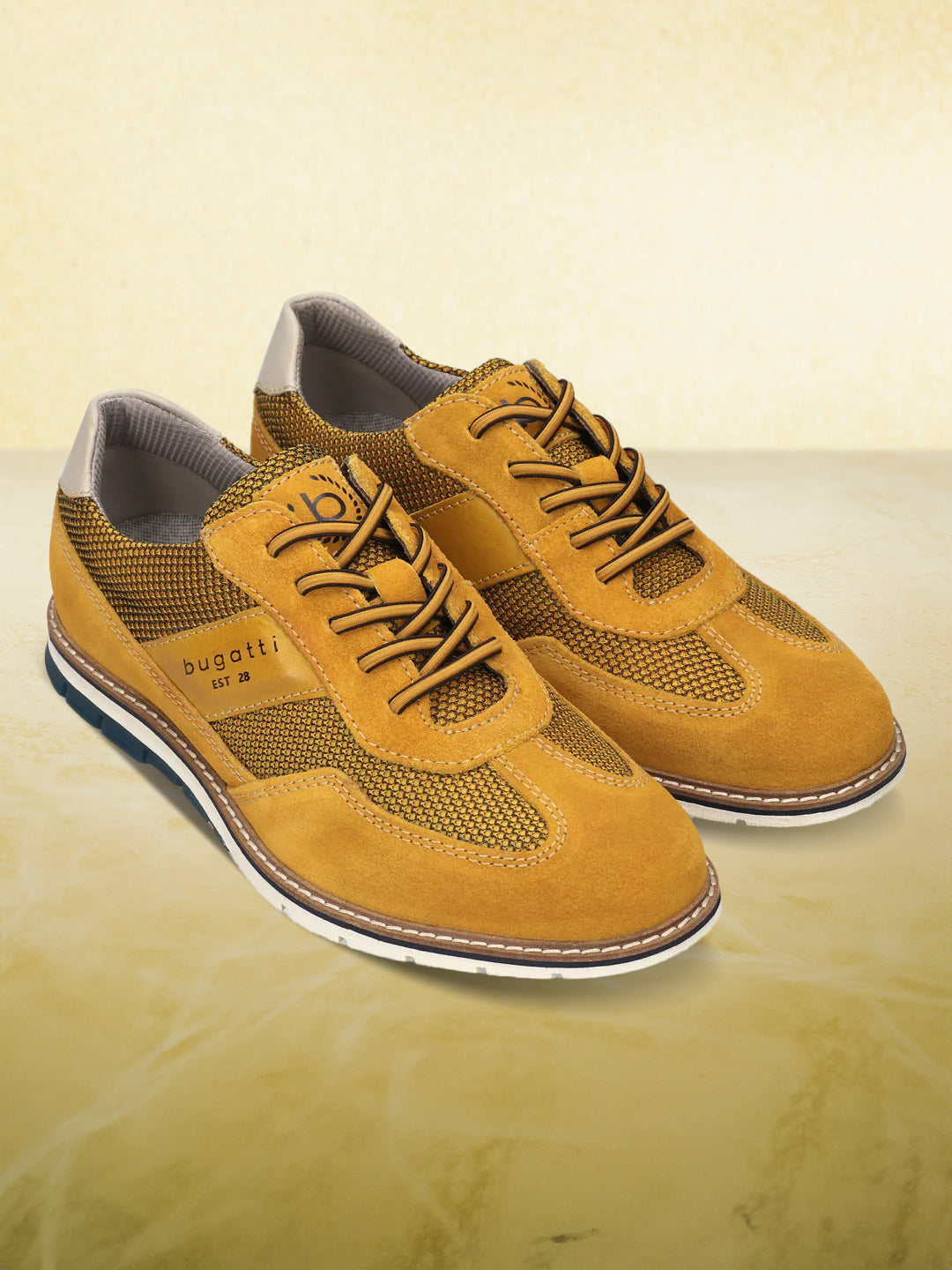 A yellow Men's bugatti Casuals Shoes featuring a round toe wing tip, zero heels heel, and a wide fit. Made from premium genuine leather with a durable tr outsole, this laces design offers both style and comfort.