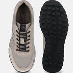 Taupe leather sneakers by bugatti with black laces and a lugged black outsole.