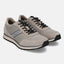 Taupe premium leather comfort sneakers by bugatti, featuring black laces and a sporty sole.