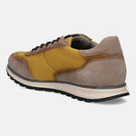 Taupe and mustard sneaker by Bugatti, with suede and textile panels, and a two-tone sole.