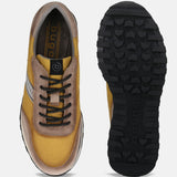 Taupe sneakers by bugatti featuring black laces and a rugged, textured black sole.