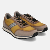 Taupe leather sneakers by bugatti with golden textile elements and black laces.