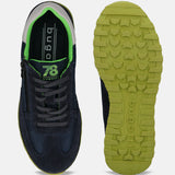 Dark blue premium leather sneakers by bugatti, showing the sole with green details, laces, and zip.
