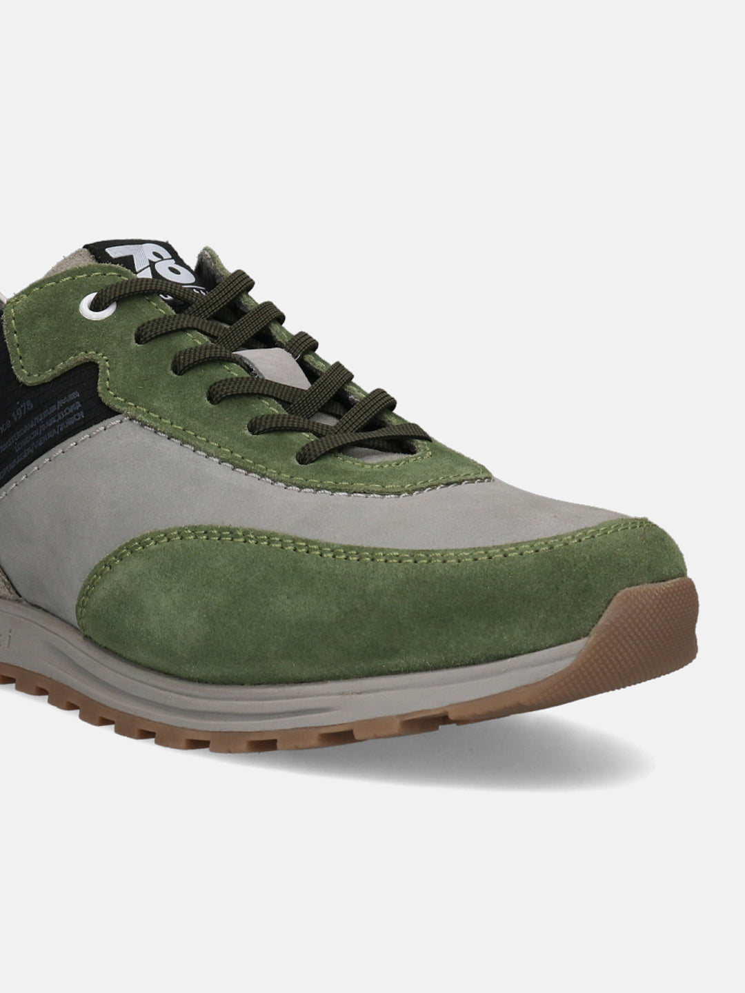 Green leather sneakers by bugatti with olive laces and a lug sole.