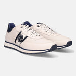 White leather comfort sneakers by bugatti, with navy accents on the sole, side stripes, and heel.