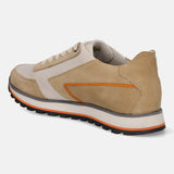 Sand premium leather comfort sneakers by bugatti, with orange accent stripe, set on a textured black outsole, from a back angle view.