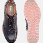 Dark blue leather sneakers by bugatti, showcasing orange accents and laces, along with patterned pink and white soles.