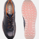 Dark blue leather sneakers by bugatti, showcasing orange accents and laces, along with patterned pink and white soles.