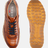 A cognac Men's bugatti Sneakers featuring a round  plain toe, zero heels heel. Made from premium genuine leather with a durable eva outsole, this laces design offers both style and comfort.