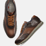 A brown Men's bugatti Sneakers featuring a round toe plain toe, zero heels heel. Made from premium genuine leather with a durable eva outsole, this laces design offers both style and comfort.