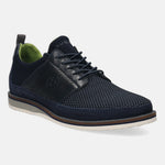 Dark blue casual shoe by bugatti, featuring a textured front, leather details, and a striped sole.