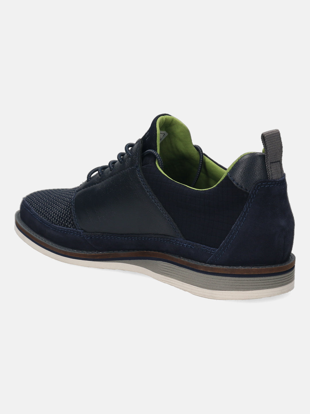 Dark blue casual shoe by bugatti with a green interior, dark sole, and suede detailing.