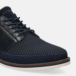 Dark blue casual shoe by bugatti with textured upper, dark laces, and layered sole.