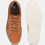 Orange casual shoes by bugatti, featuring suede accents and a textured rubber sole.
