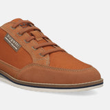 Cropped view of orange casual shoe by Bugatti, showing a textile and suede upper, with matching laces.