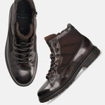 A brown Men's bugatti Ankle Boots featuring a round toe plain toe, moulded  heel. Made from premium genuine leather with a durable tr outsole, this zipper design offers both style and comfort.