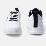White comfort sneakers by bugatti with navy blue accents on the laces and heel.