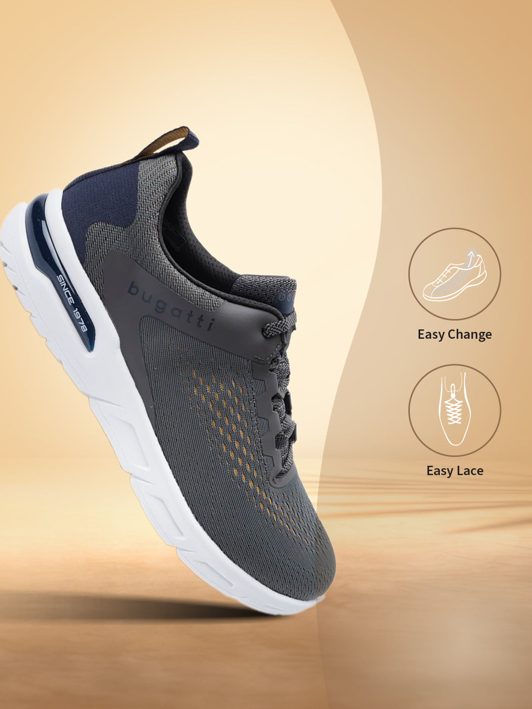 Dark grey Nubola mid top sneakers by bugatti, with white soles and easy lace design.