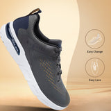 Dark grey Nubola mid top sneakers by bugatti, with white soles and easy lace design.