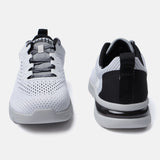 White comfort mid-top sneakers by bugatti, with a textured upper and black accents at the heel.