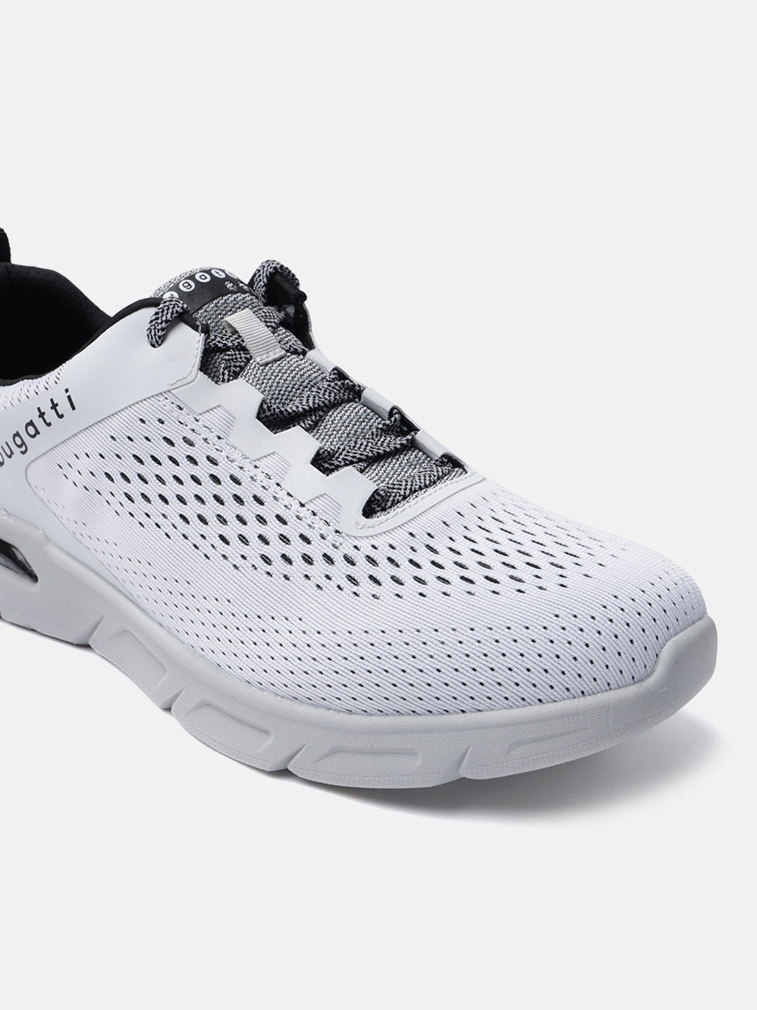 White comfort sneakers by Bugatti with black and grey laces and a white perforated upper.
