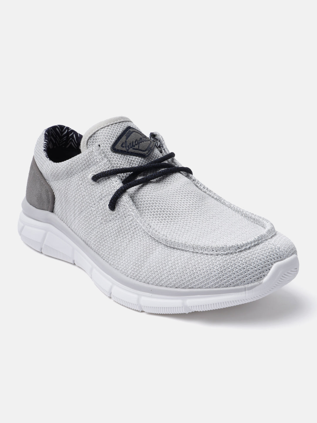 Light grey comfort mid-top sneaker by bugatti with black laces and a white rubber sole.