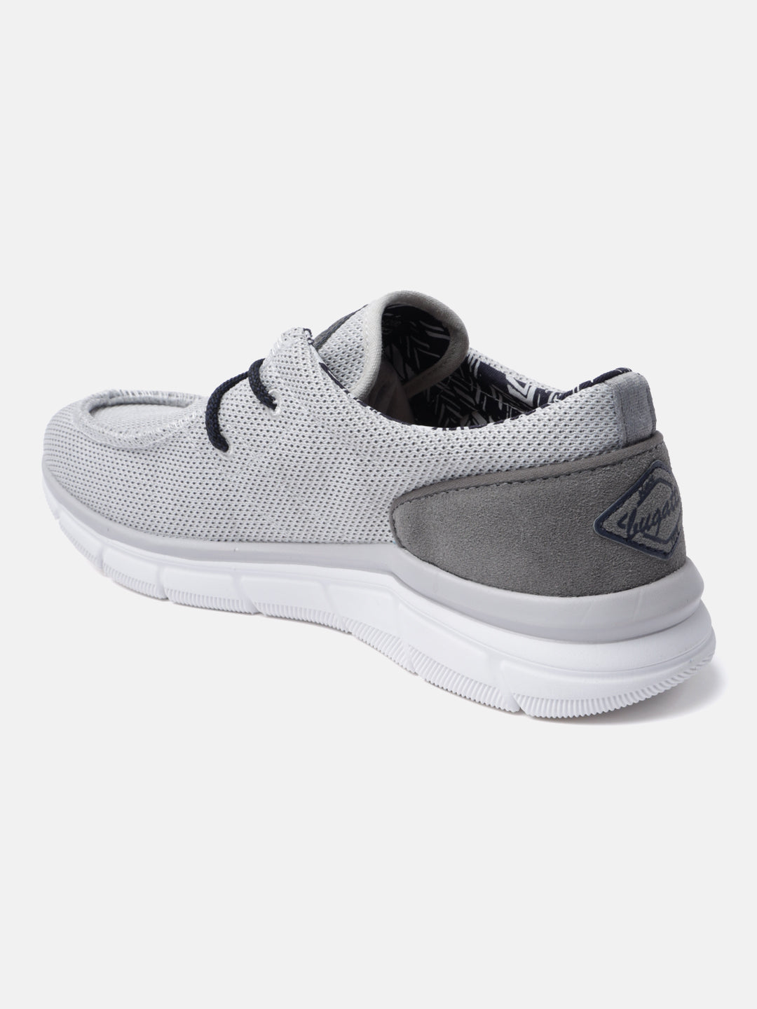 Light grey comfort sneaker by bugatti featuring tonal grey suede heel accent and white sole.